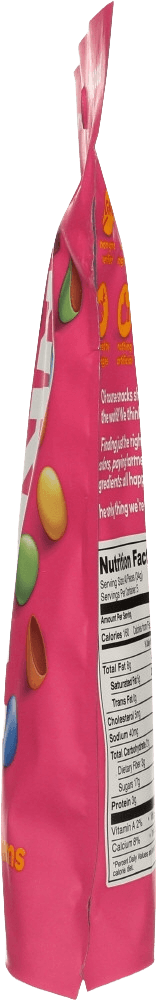 Side view of Unreal Milk Chocolate Gems 5oz pouch showing nutrition facts and colorful candy graphics. Perfect for ethical chocolate lovers.