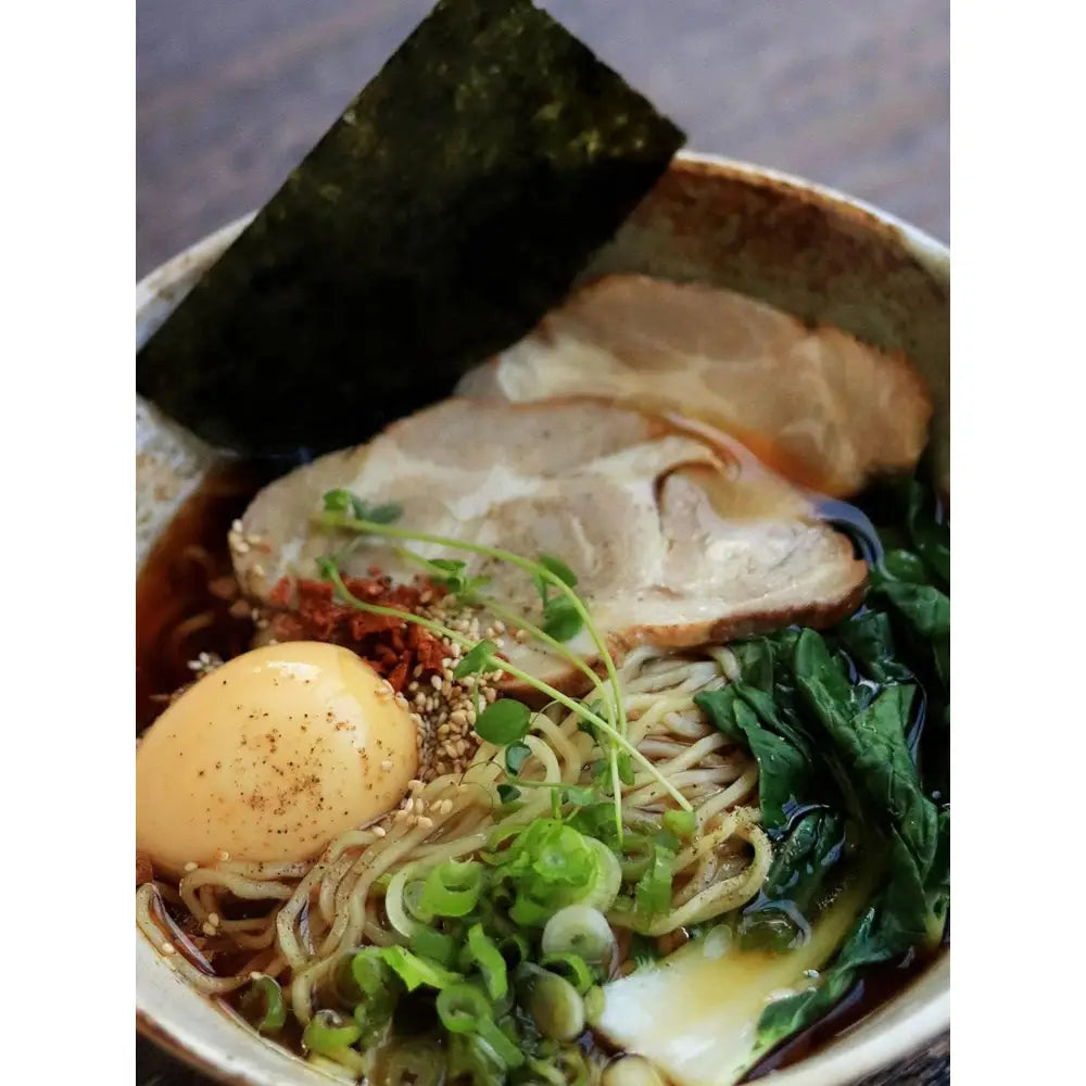 Close-up of miso ramen with soft-boiled egg, noodles, and toppings